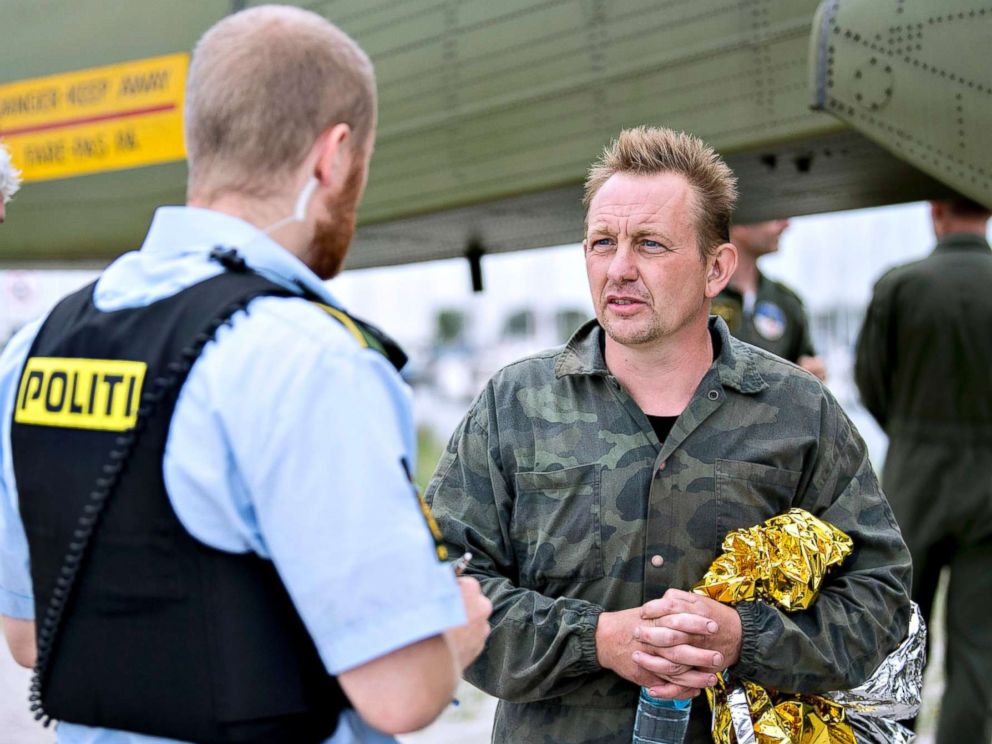 PHOTO: Peter Madsen,right, builder and captain of the private submarine UC3 Nautilus as he talks to a police officer in Dragoer Harbor south of Copenhagen on Aug. 11, 2017.