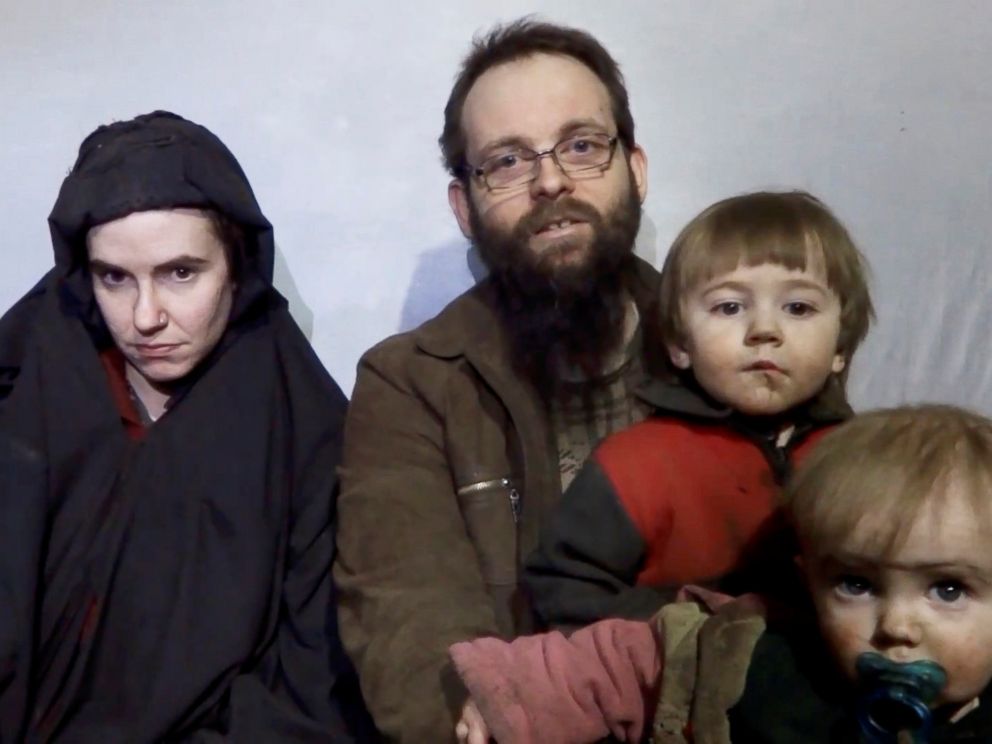 PHOTO: A still image from a video posted by the Taliban on social media, Dec. 19, 2016, shows American Caitlan Coleman next to her Canadian husband Joshua Boyle and their two sons.