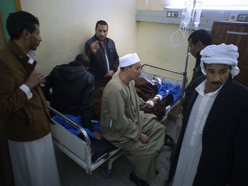 Relatives of Sheikh Sulieman Ghanem, 75, center, surround him as he receives medical treatment at Suez Canal University hospital in Ismailia, Egypt, Friday, Nov. 24, 2017, after he was injured during an attack on a mosque. Militants attacked a crowde