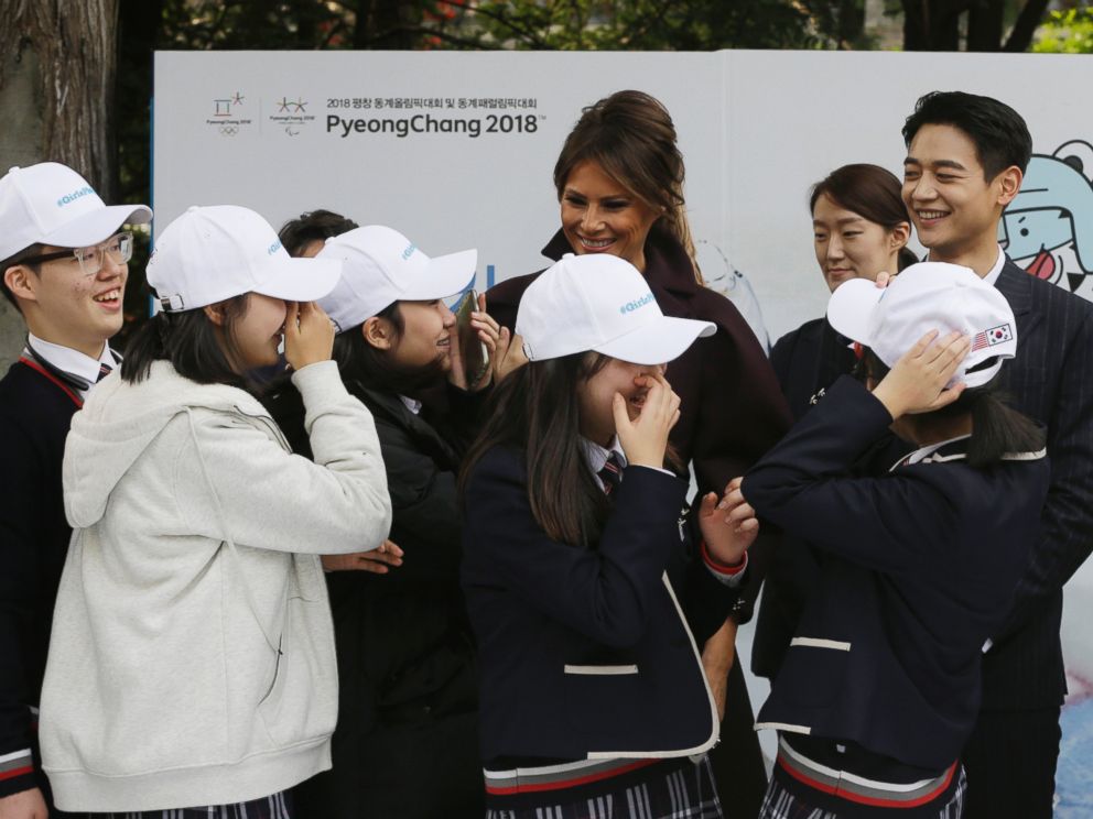 U.S. first lady Melania Trump is greeted by South Korean middle school students as Choi Min-ho, a member of South Korean boy band Shinee, top right, watches during Girls Play 2! Initiative.