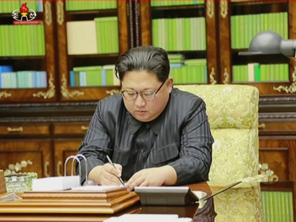 This image made from video of a news bulletin aired by North Koreas KRT on Nov. 29, 2017, shows an image of North Koreas leader Kim Jong Un signing what is said to be a document on Nov. 28, 2017, authorizing a missile test. 