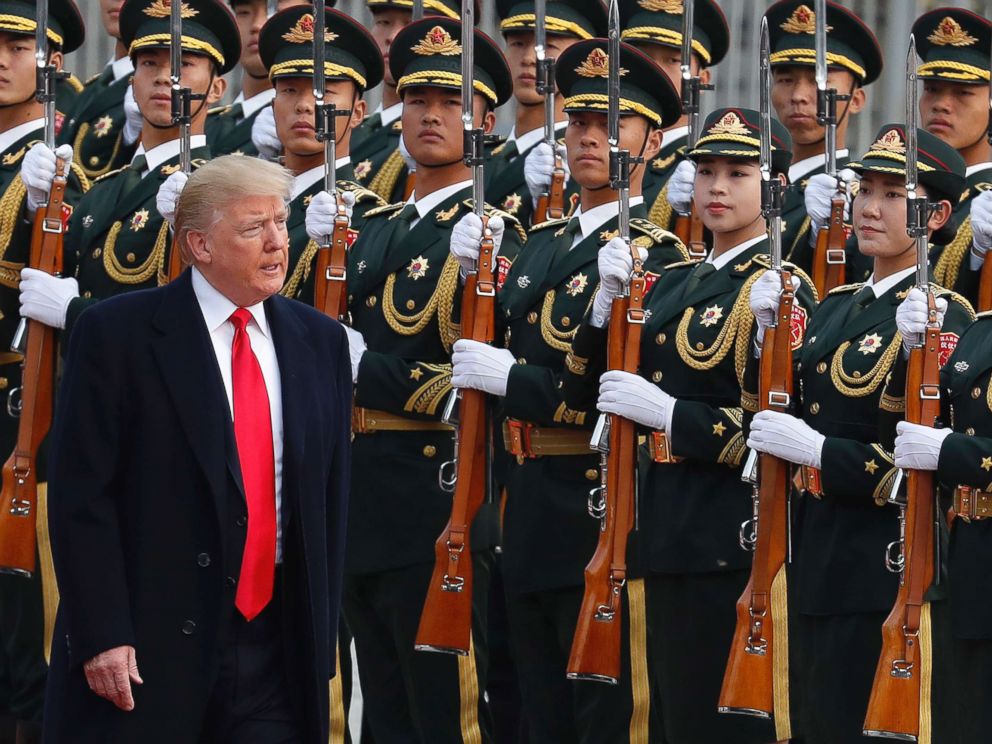 PHOTO: President Donald Trump reviews an honor guard during a welcome ceremony at the Great Hall of the people in Beijing, Nov. 9, 2017. 