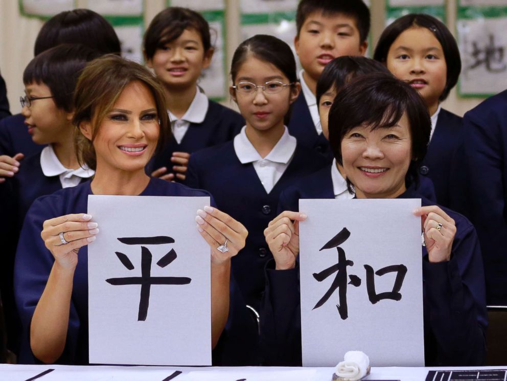 PHOTO: First Lady Melania Trump and Japanese Prime Minister Shinzo Abes wife Akie show off calligraphy they wrote as they attend a calligraphy class of the 4th grader at Kyobashi Tsukiji Elementary School, Nov. 6, 2017, in Tokyo. 