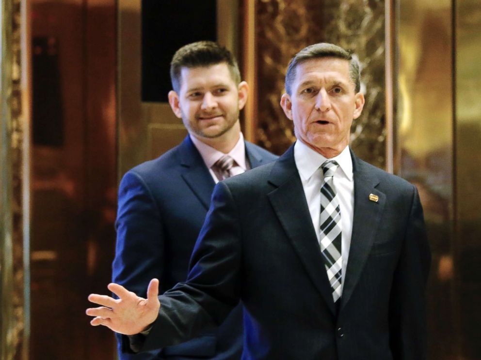 PHOTO: Michael Flynn Jr. is seen behind his father, retired Lt. Gen. Michael Flynn, as they arrive at Trump Tower in New York on Nov. 17, 2016. 