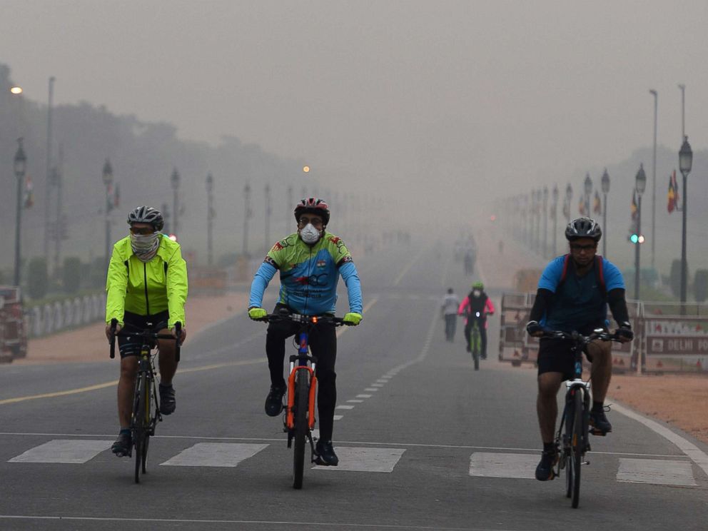 PHOTO: Cyclists ride in the early morning as smogs New Delhi, Nov. 6, 2017.