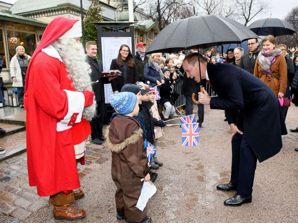 PHOTO: Prince William gives a Christmas list from Prince George to Santa Claus at Esplanade Parks Christmas market in Helsinki, Nov. 30, 2017.