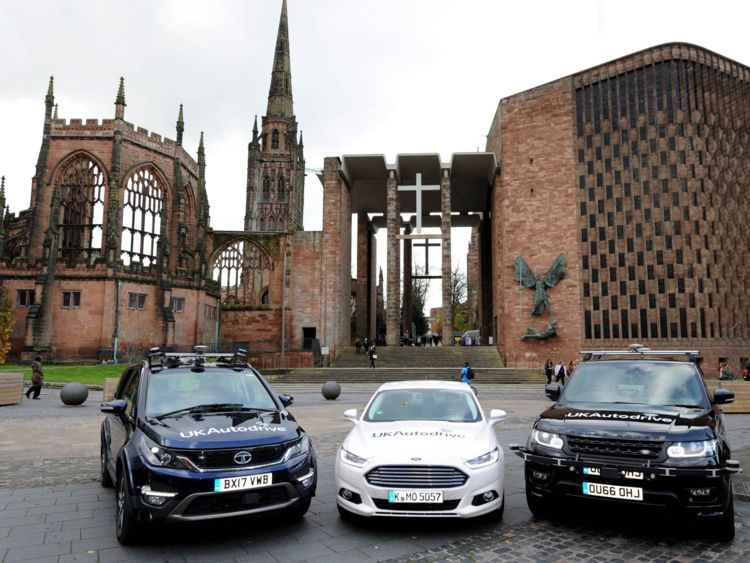 The cars involved in the trial in front of Coventry Cathedral