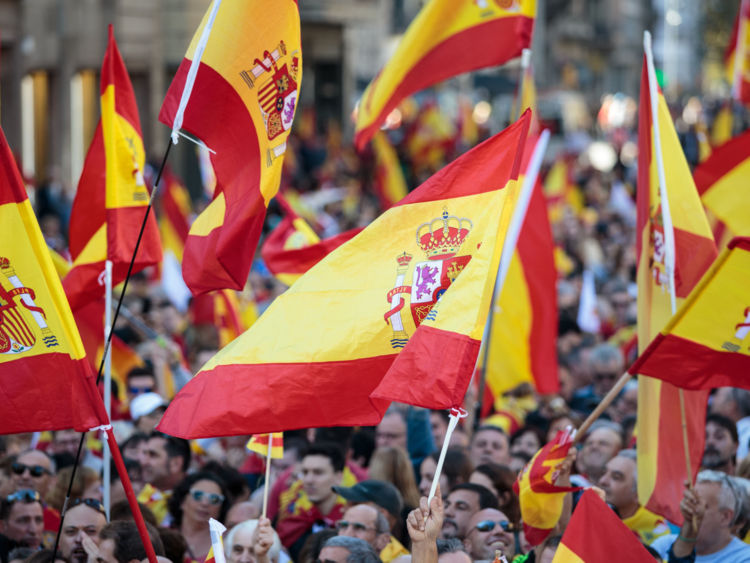 BARCELONA, SPAIN - OCTOBER 29: Protesters wave Spanish flags during a pro-unity demonstration on October 29, 2017 in Barcelona, Spain. Thousands of pro-unity protesters gather in Barcelona, two days after the Catalan Parliament voted to split from Spain. The Spanish government has responded by imposing direct rule and dissolving the Catalan parliament. (Photo by Jack Taylor/Getty Images)