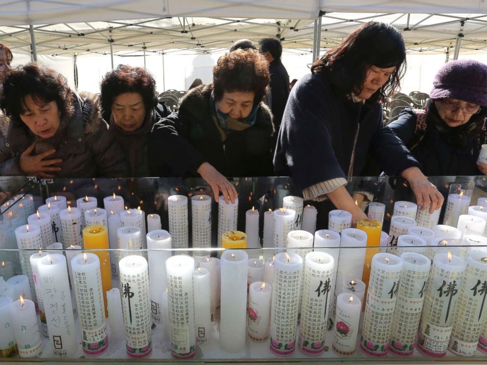 PHOTO: Women place candles during a special service to wish for their family members success in the college entrance exams at the Jogye temple in Seoul, South Korea, Nov. 23, 2017.