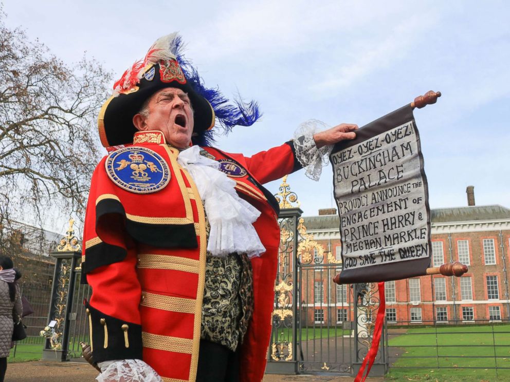 PHOTO: A town crier outside Kensington Palace announces the Royal engagement of Prince Harry to Meghan Markle, Nov. 27, 2017, in London.