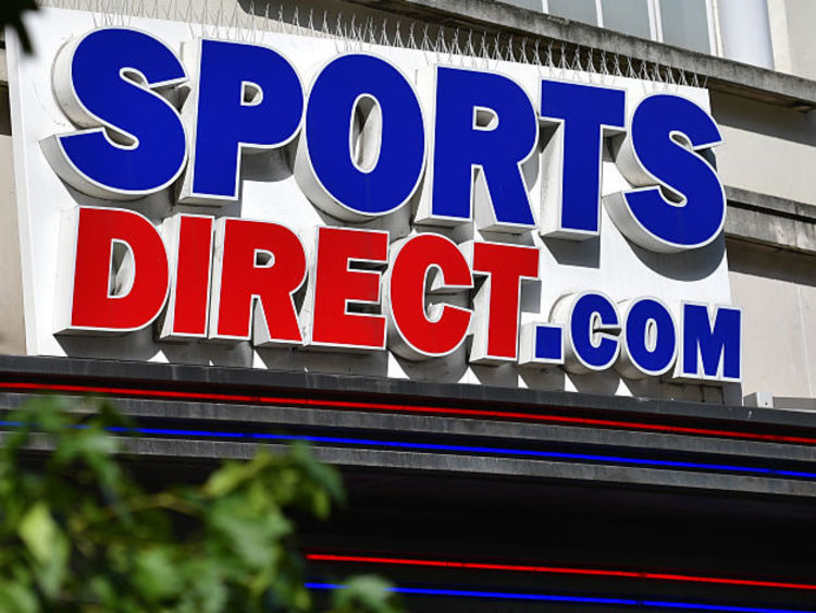 Sports Direct has blamed bad publicity and currency woes for weaker profits