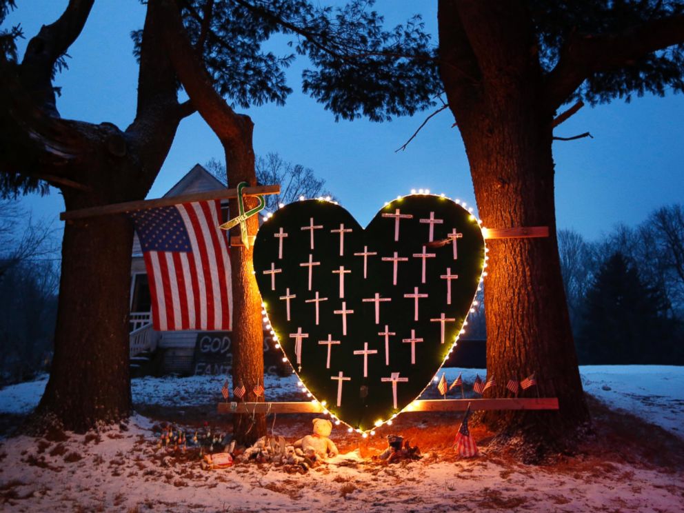 PHOTO: A memorial with crosses for the victims of the Sandy Hook Elementary School shooting massacre stands outside a home in Newtown, Conn., on the one-year anniversary of the shootings, Dec. 14, 2013.