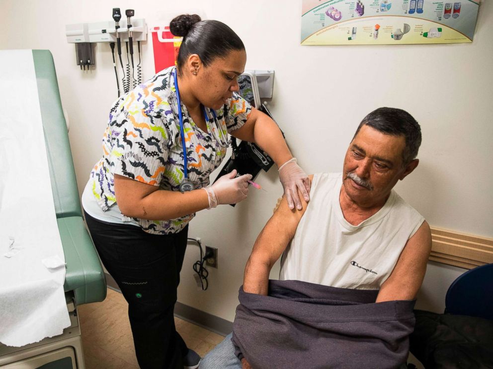 PHOTO: Medical Assistant Gloria Castro administers an injection to patient Angel Rosa at the Esperanza Health Center in Philadelphia, on March 13, 2017.