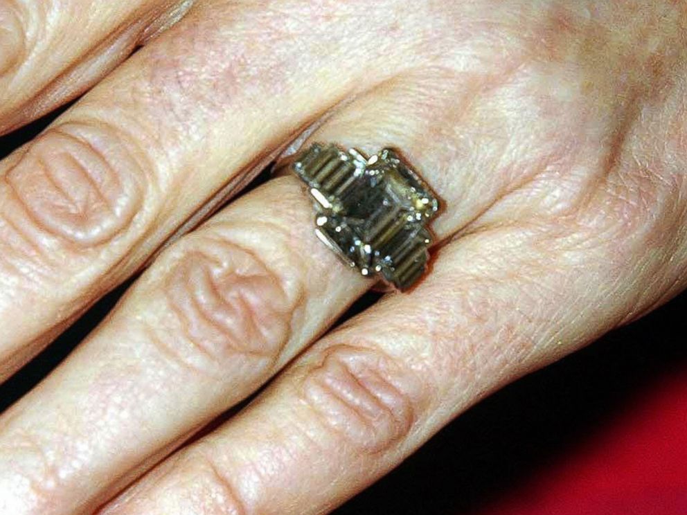 PHOTO: Camilla Parker Bowles shows off her engagement ring as she and Prince Charles arrive for a party at Windsor Castle after announcing their engagement earlier on Feb. 10, 2005. 