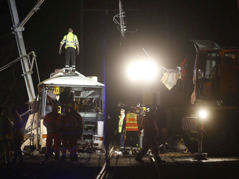 PHOTO: Firefighters and police work at the site of an accident in Millas, near Perpignan, southern France, on Dec. 14, 2017, after a train crashed into a school bus at a level crossing.