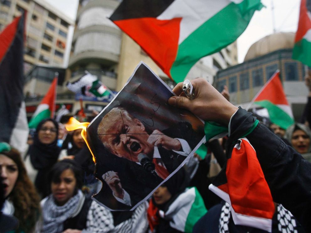 PHOTO: Lebanese and Palestinians students, burn a poster of U.S. President Donald Trump as they take part in a protest, in the southern port city of Sidon, Lebanon, Thursday, Dec. 7, 2017.