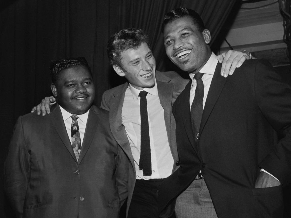 PHOTO: Fats Domino (L) being congratulated by French singer Johnny Hallyday (C) and US boxing champion Ray Sugar Robinson following his performance at the Palais des Sports in Paris, Oct. 20, 1962. 