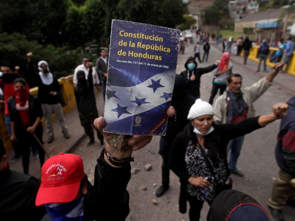 PHOTO: An opposition supporter holds up the Constitution of the Republic of Honduras during a protest over a contested presidential election with allegations of electoral fraud in Tegucigalpa, Honduras, Dec. 22, 2017. 