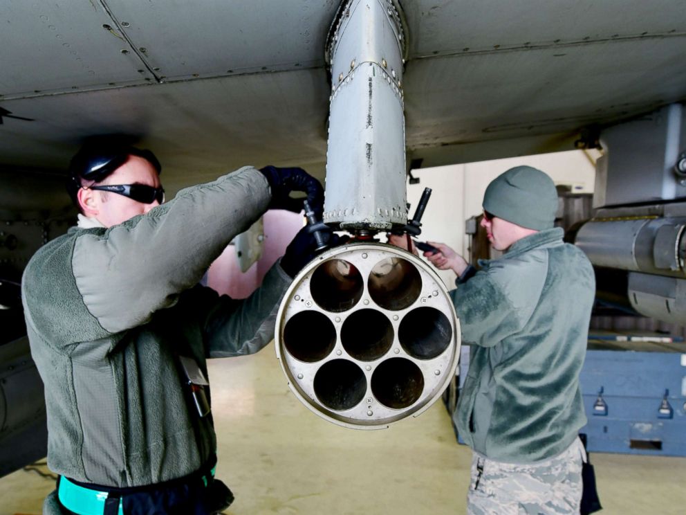 PHOTO: U.S. Air Force Senior Airmen Hamlin Burch and Jacob Wiemers remove a weapon system from an A-10 Thunderbolt II aircraft during exercise Vigilant Ace 18 at Osan Air Base, Republic of Korea, Dec. 2, 2017. 