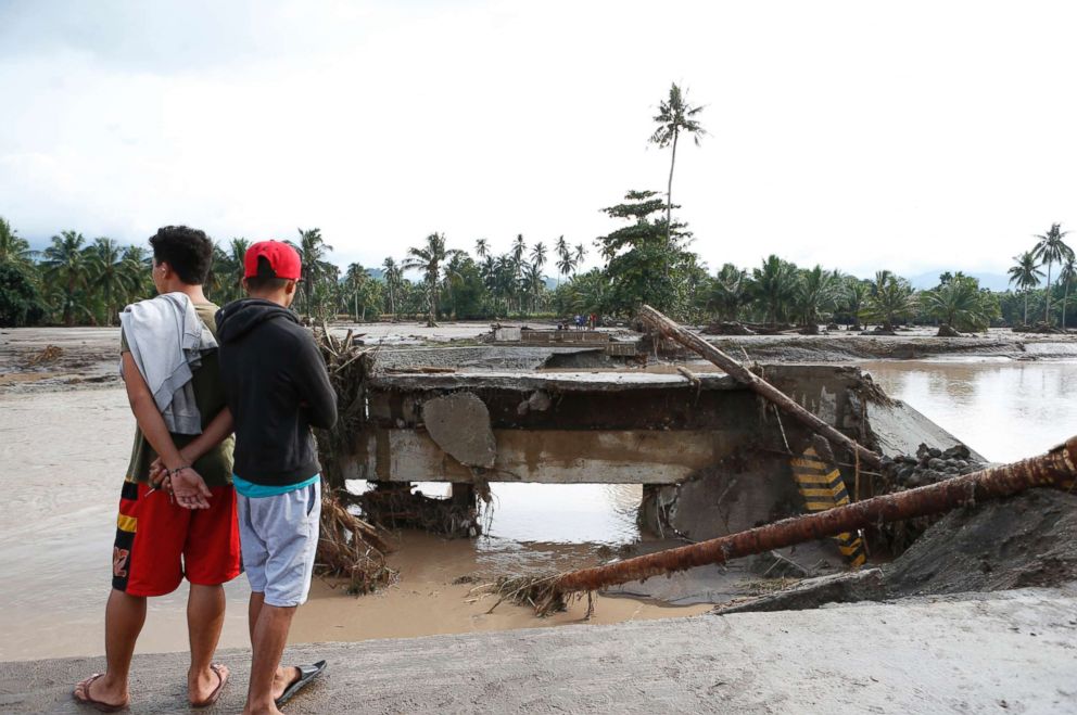 PHOTO: Filipino villagers view a damaged bridge in the flood hit town of Salvador, Lanao del Norte province, Philippines, Dec. 23, 2017. 