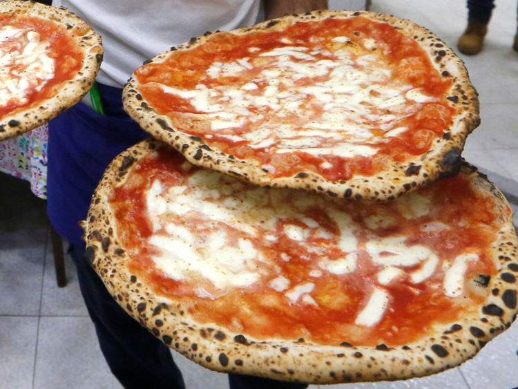 Pizza Margherita at L'Antica Pizzeria da Michele in Naples, Italy 