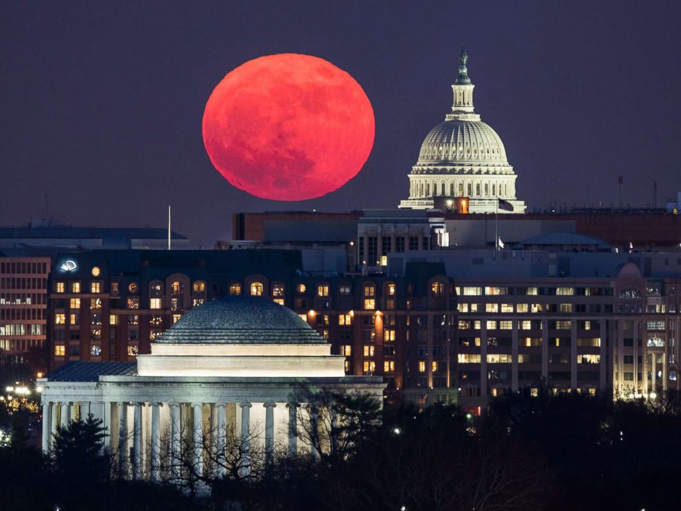 PHOTO: A supermoon rises behind the US Capitol and the Jefferson Memorial, in Washington, DC, viewed from Arlington, Virginia, Dec. 3, 2017. 