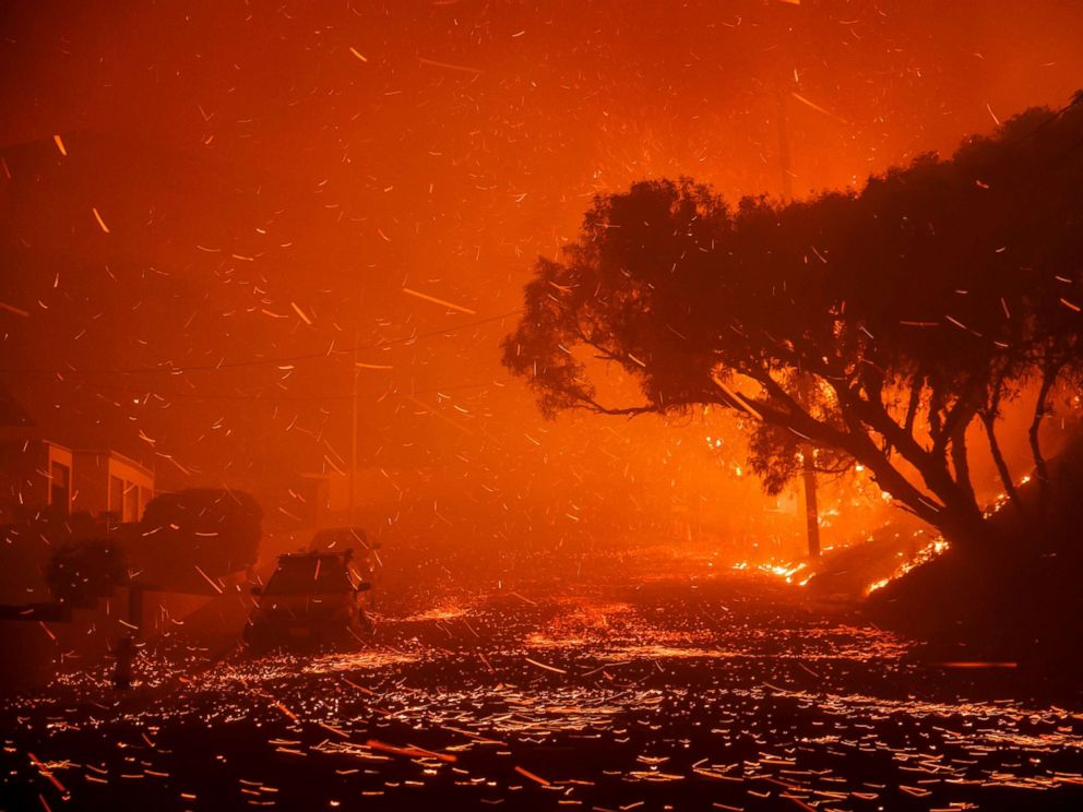 PHOTO: A brush fire moving with the wind sends embers all over the place in residential neighborhoods north of Ventura, destroying homes and forcing 27,000 people to evacuate.