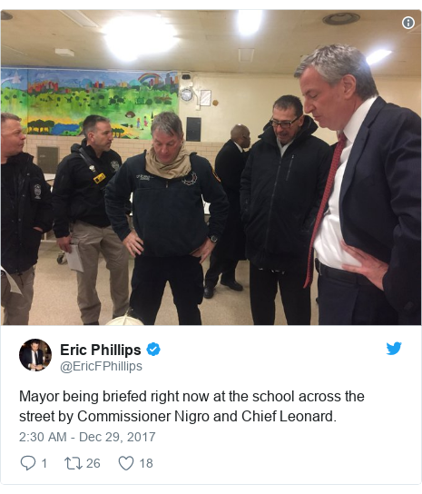 Twitter post by @EricFPhillips: Mayor being briefed right now at the school across the street by Commissioner Nigro and Chief Leonard. 