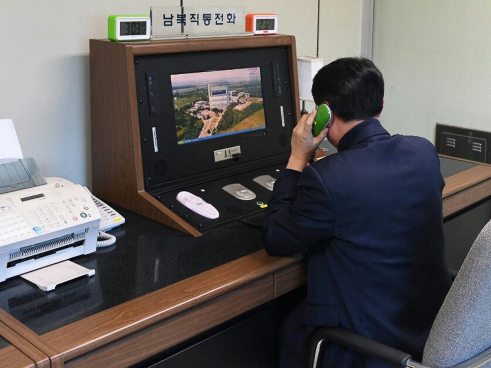A South Korean government official checks the direct communications hotline to talk with the North Korean side at the border village of Panmunjom in Paju, South Korea, Wednesday, Jan. 3, 2018. North Korean leader Kim Jong Un reopened a key cross-bord