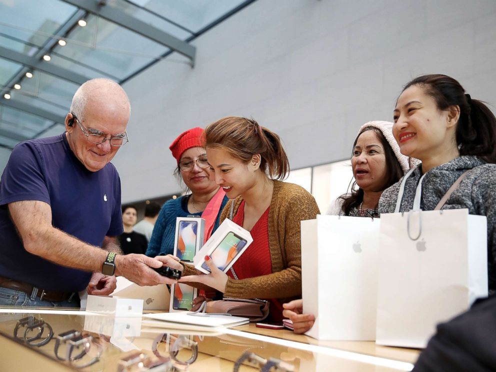 PHOTO: A customer purchases the new iPhone X at an Apple Store on Nov. 3, 2017, in Palo Alto, Calif. 