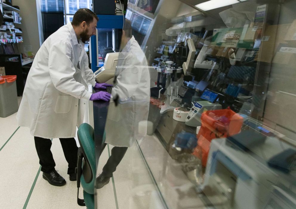 PHOTO: Biologist Jason Plyler prepares to test how immune cells react to possible flu vaccines at the Vaccine Research Center at the National Institutes of Health, Dec. 19, 2017, in Bethesda, Md. 