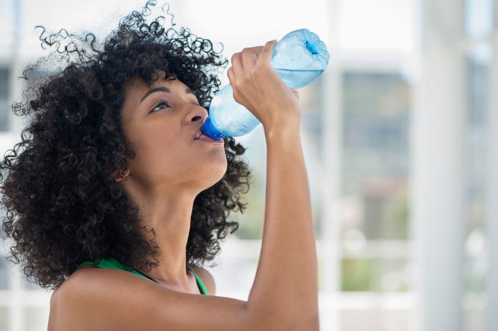 PHOTO: A woman is drinking more water for a new years resolution seen in this stock image. 