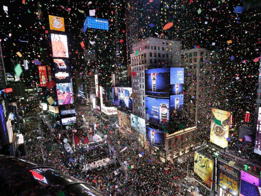 PHOTO: Confetti drops over the crowd as the clock strikes midnight during the New Years celebration in Times Square, New York, Jan. 1, 2018. 