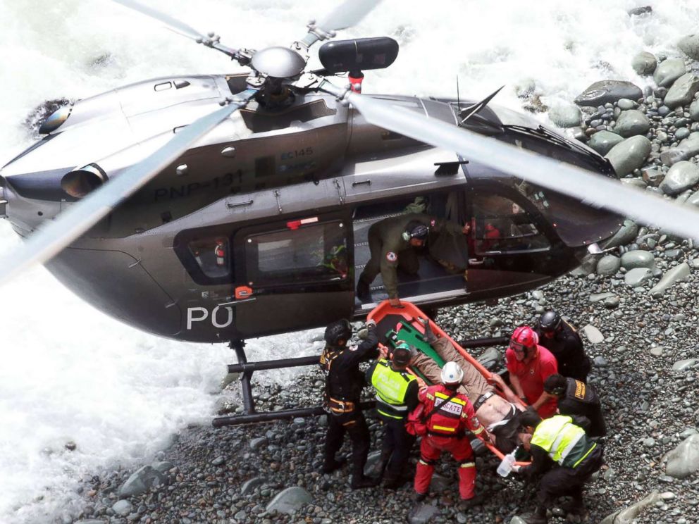 PHOTO: Emergency personnel load a victim onto a helicopter during rescue operations after a passenger bus plunged off the Pan-American Highway North, outside of Lima, Peru, Jan. 2, 2018.