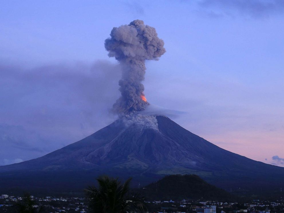 PHOTO: This photo taken from a drone shows a column of ash shooting up from the Mayon volcano as it continues to erupt, seen from the city of Legazpi in Albay province, south of Manila, Jan. 24, 2018.