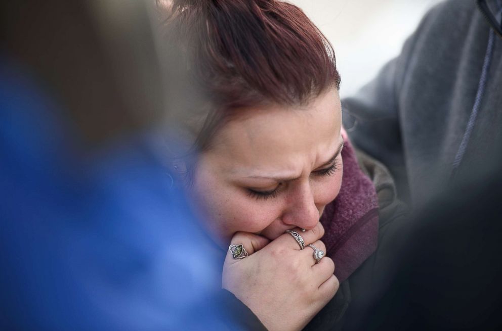 PHOTO: Sierra Kolarik, the sister of Chelsie Cline, one of the victims in a mass shooting at Eds Car Wash, is comforted, Jan. 28, 2018 in Melcroft, Pa.