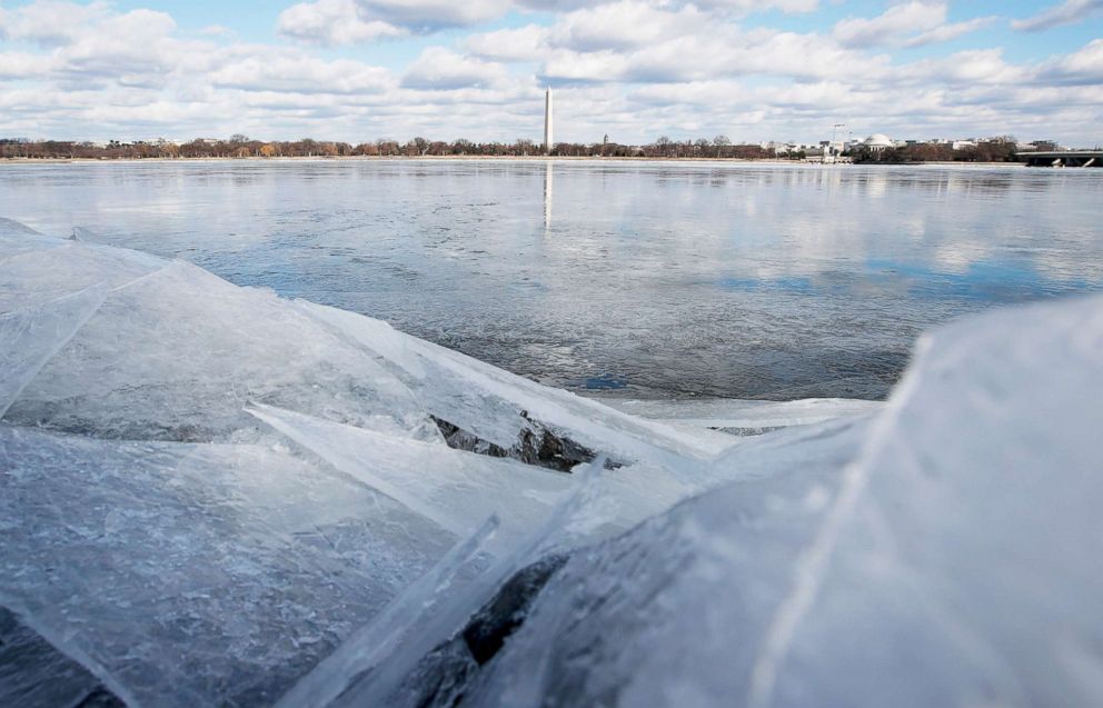 PHOTO: The Washington Monument stands in the distance, reflected in the frozen Potomac River, Jan. 1, 2018, from Arlington, Va. 