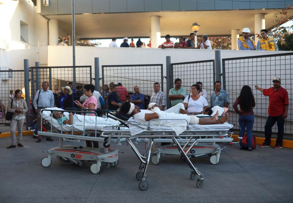 PHOTO: Patients rest in their hospital beds parked outside the General Hospital after they were evacuated, in Veracruz, Mexico, Feb. 16, 2018.