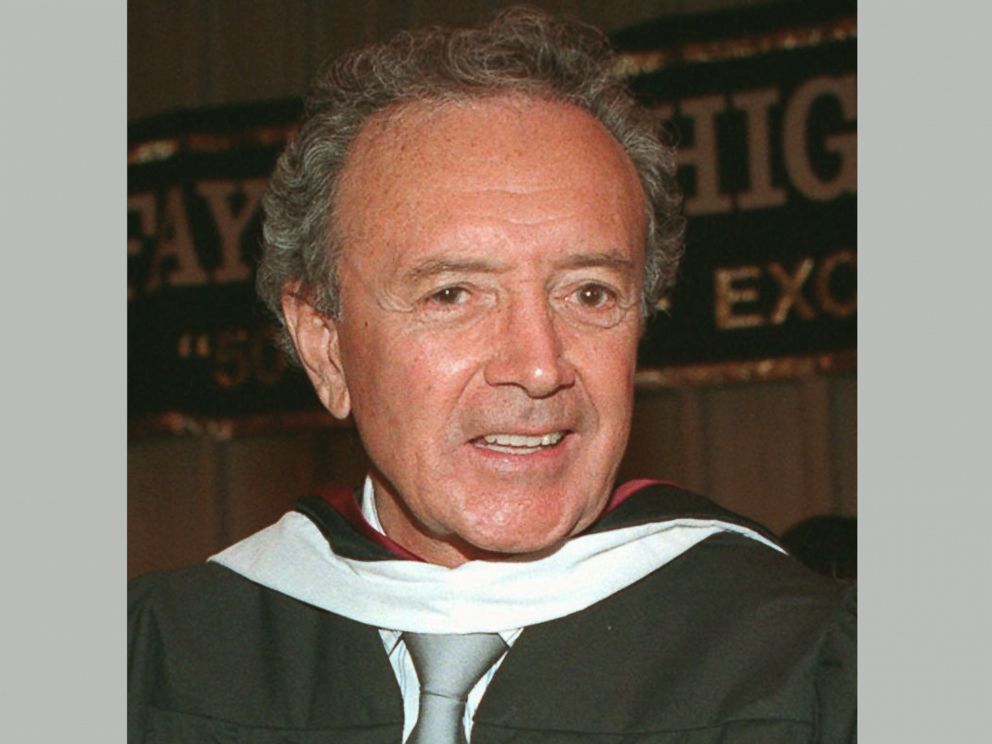 FILE - In this Feb. 3, 1997 file photo, singer Vic Damone poses after becoming a member of Lafayette High Schools midyear graduating class, in the Brooklyn borough of New York. Damone died Sunday, Feb. 11, 2018, at a Miami Beach hospital from compli