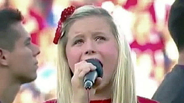 PHOTO: Harper Gruzins, 11, sings ?The Star-Spangled Banner," at a major league soccer game in Dallas, Texas.