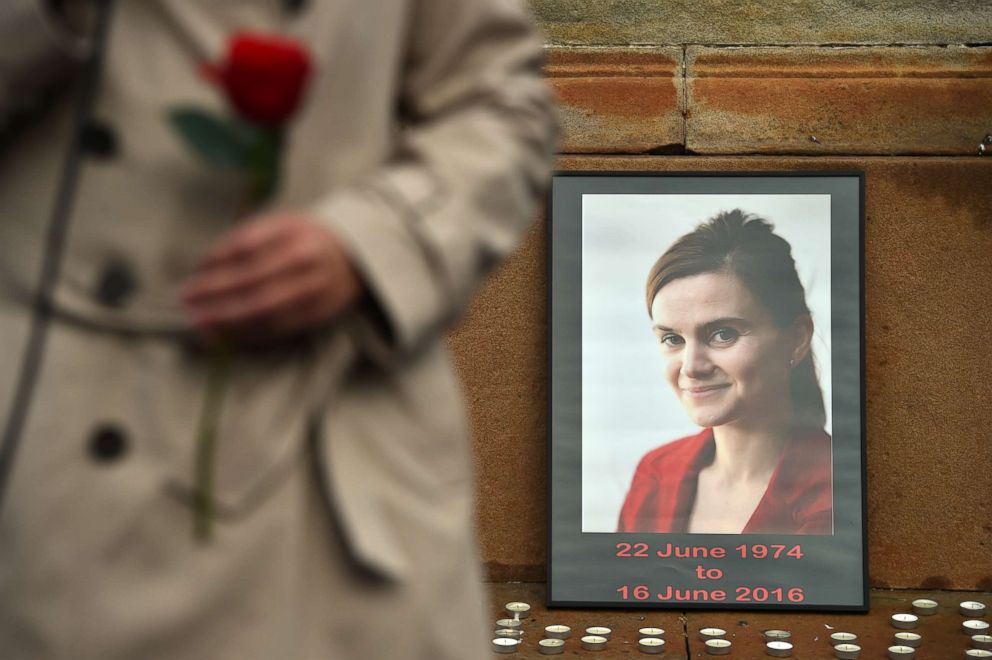 PHOTO: Candles surround a photo of Labour MP Jo Cox before a vigil in her memory as the Leader of Scottish Labour party Kezia Dugdale holds a rose in George Square, June 17, 2016, in Glasgow, Scotland. 