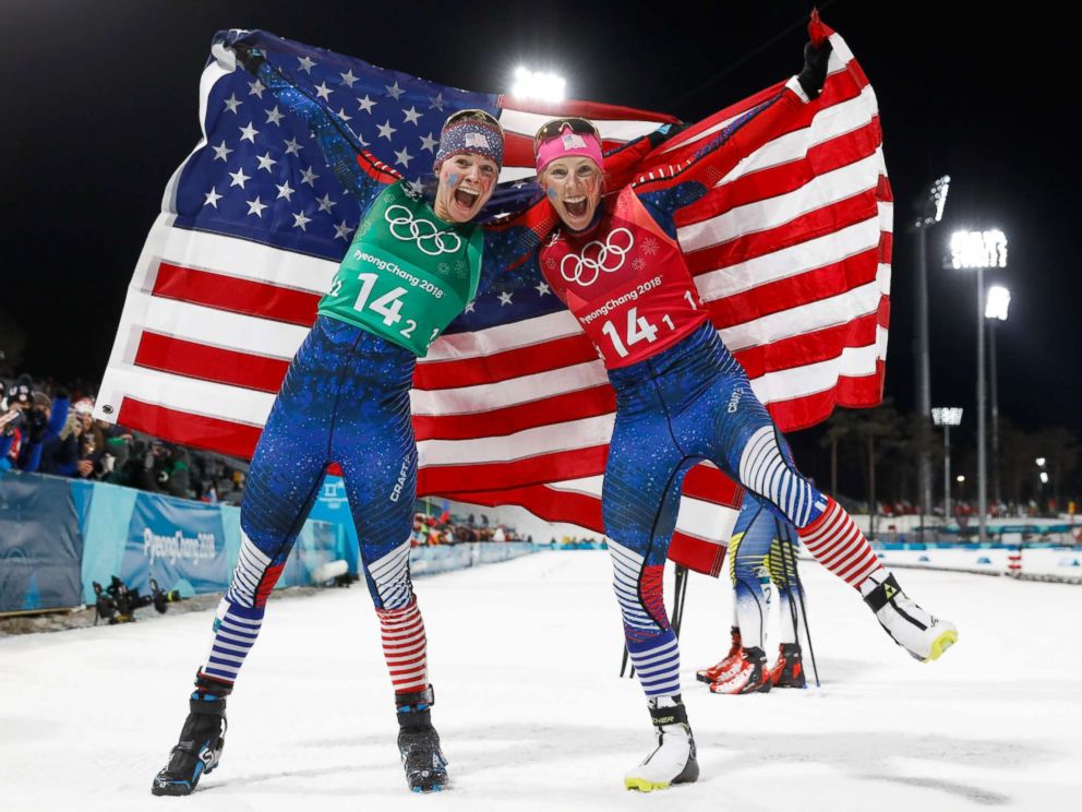 PHOTO: Americans Jessica Diggins, left and Kikkan Randall celebrate winning the gold medal in the womens cross country team sprint free final, Feb. 21, 2018.