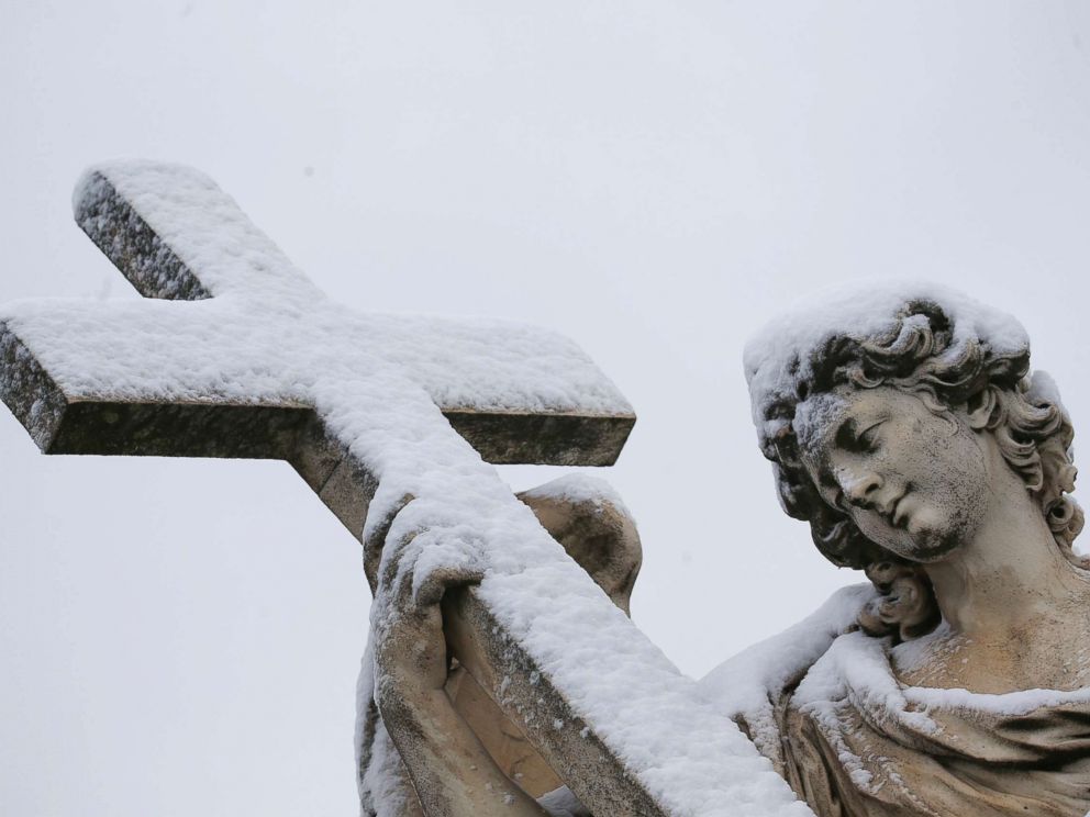 PHOTO: A statue is seen covered in snow during a heavy snowfall in Rome, Feb. 26, 2018.