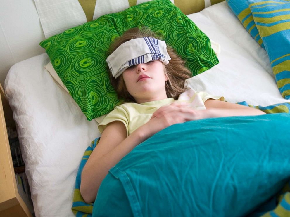 PHOTO: A sick girl lies in bed in this undated stock photo.
