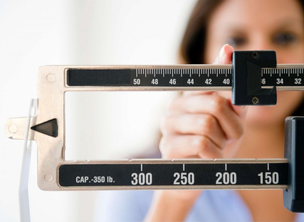PHOTO: A woman uses a weight measure in this undated stock photo.