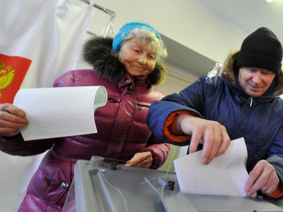 People cast their ballots at a polling station in Yelizovo, about 30 kilometers ( 19 miles) north-east from Petropavlovsk-Kamchatsky, capital of Kamchatka Peninsula region, Russian Far East, Russia, on Sunday, March. 18, 2018. Polls have opened in Ru