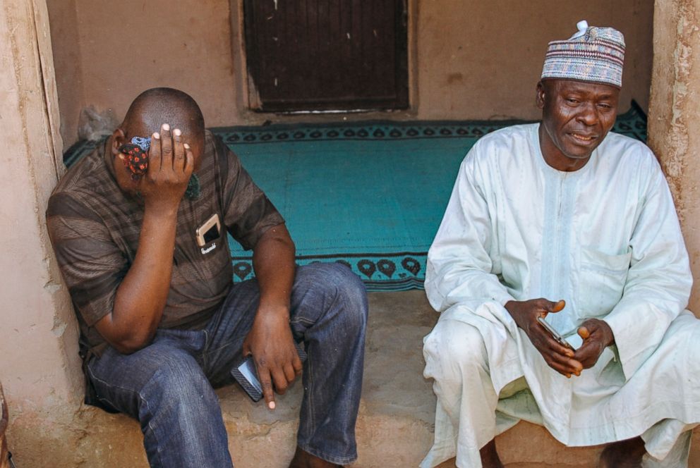PHOTO: Alhaji Inuwa, left, the father of one of the 110 schoolgirls kidnapped by Boko Haram weeps in Dapchi, Nigeria on March 21, 2018. Most of the kidnapped girls have been released by the group, according to the Nigerian government. 