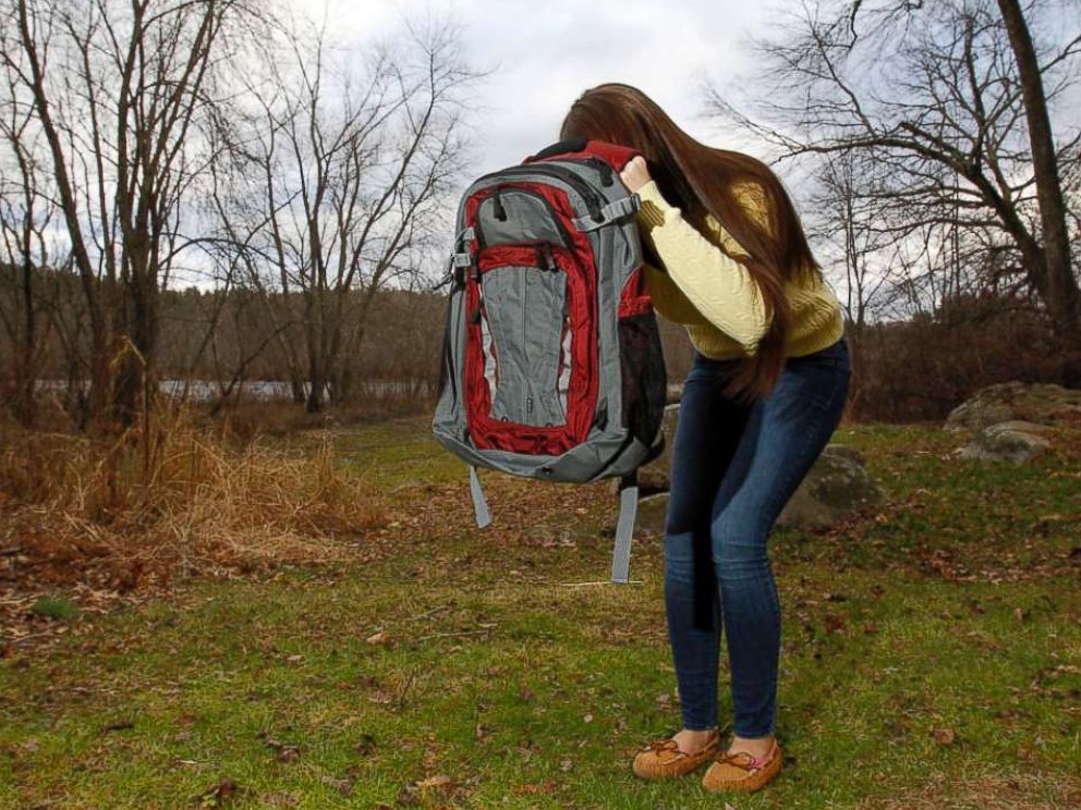 PHOTO: Amanda Curran, 18, daughter of Bullet Blocker inventor Joe Curran, demonstrates how to use a childs bulletproof backpack in the event of a shooting outside of Currans home in Billerica, Mass. Dec.19, 2012