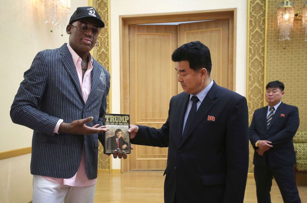 PHOTO: Former NBA basketball star Dennis Rodman presents a book titled Trump The Art of the Deal to North Koreas Sports Minister Kim Il Guk on June 15, 2017, in Pyongyang, North Korea.