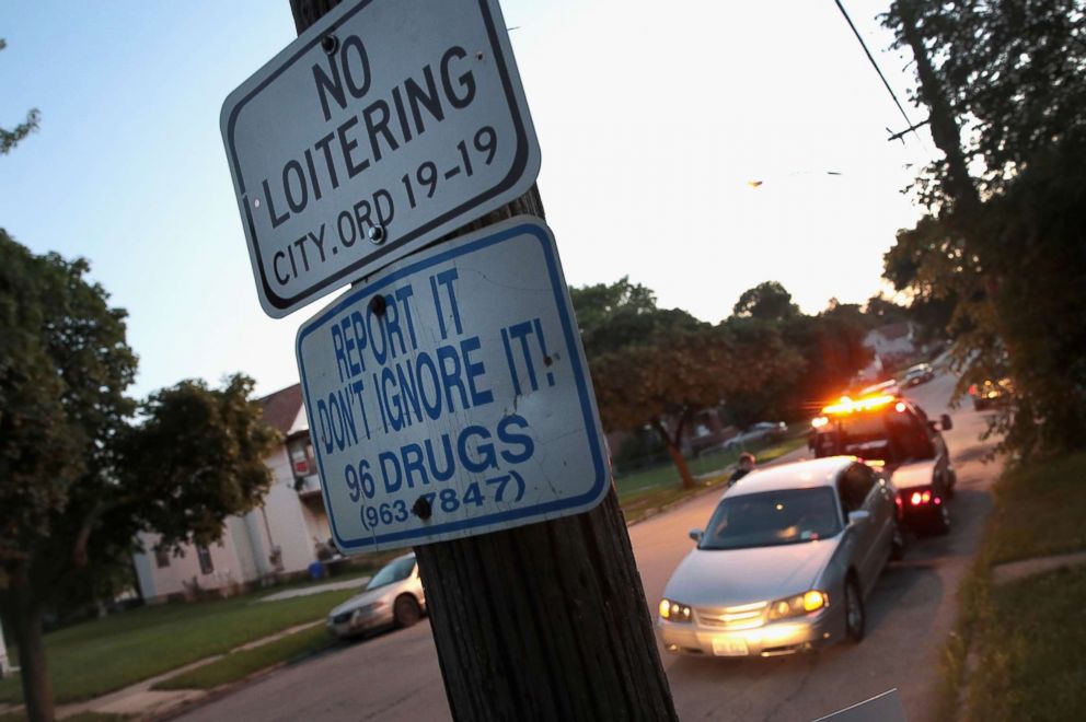 PHOTO: A sign encourages residents to report drug problems in Rockford, Illinois, July 13, 2017. This city of about 150,000 located in northern Illinois, averages about 2 overdose deaths per week, most which are heroin related. 